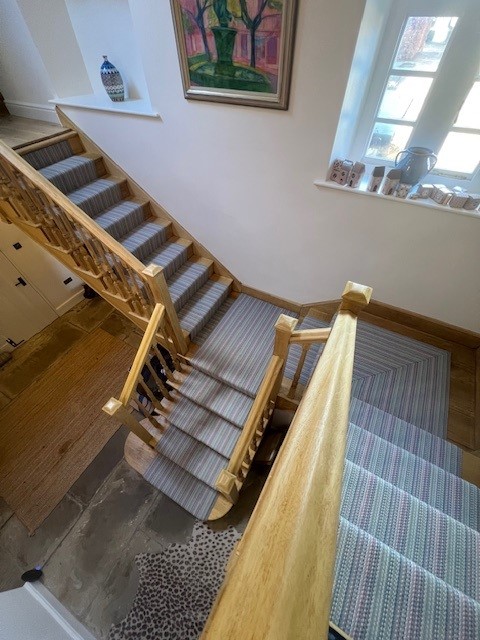 Roger Oates Venetian Flatweave stair runner across a full oak stairwell by Select Line