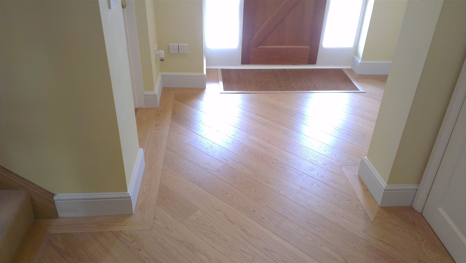Prefinished engineered oak flooring with a matching border by Select Line