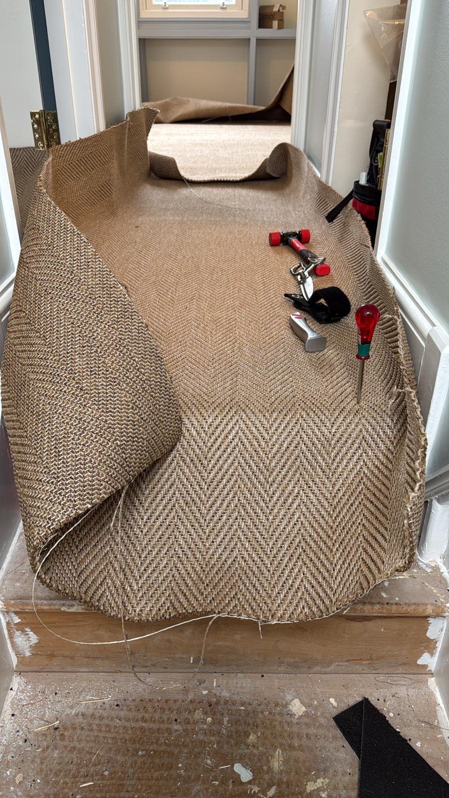 Skilled craftsman fitting and pattern matching herringbone flooring by Select Line