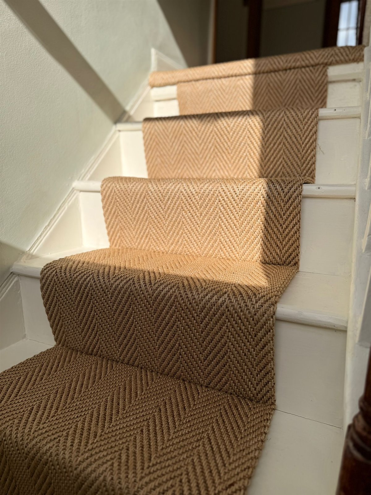 Herringbone natural flooring pattern matched up a staircase in Hammersmith by Select Line